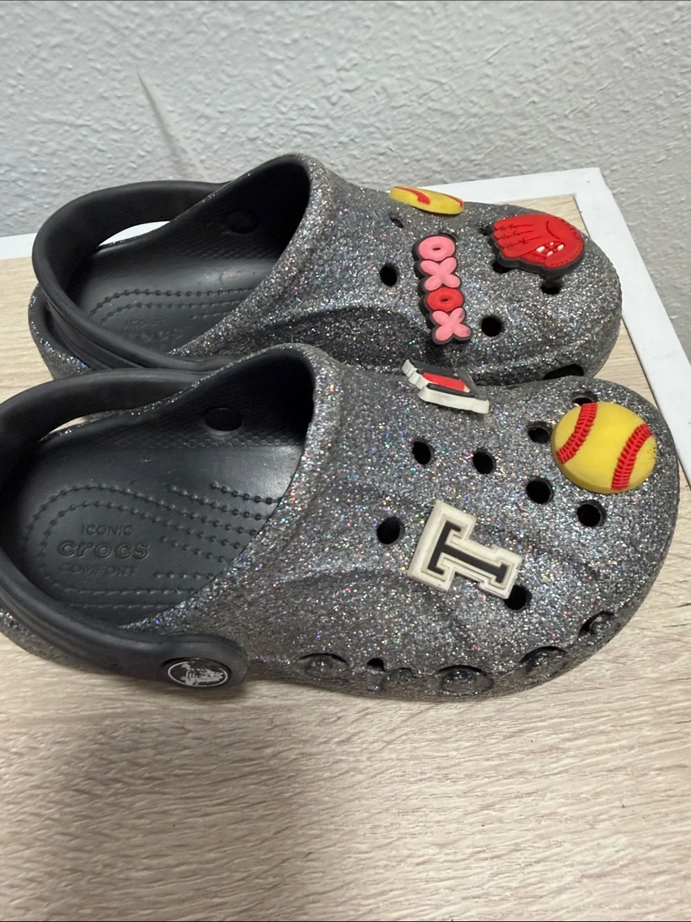 CROCS Kids' Silver Glitter Clog with Red & Yellow Sports Charms
